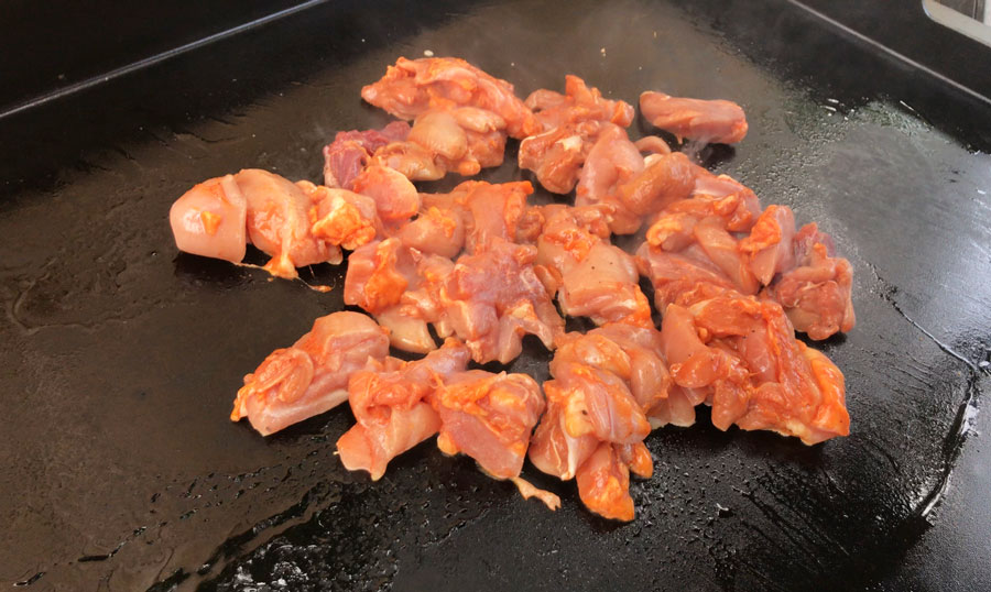 Chicken chorizo mixed in with Chicken fajitas on a skillet