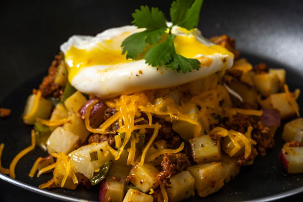 Wake up and start the day with some delicious chorizo hash with poached eggs!