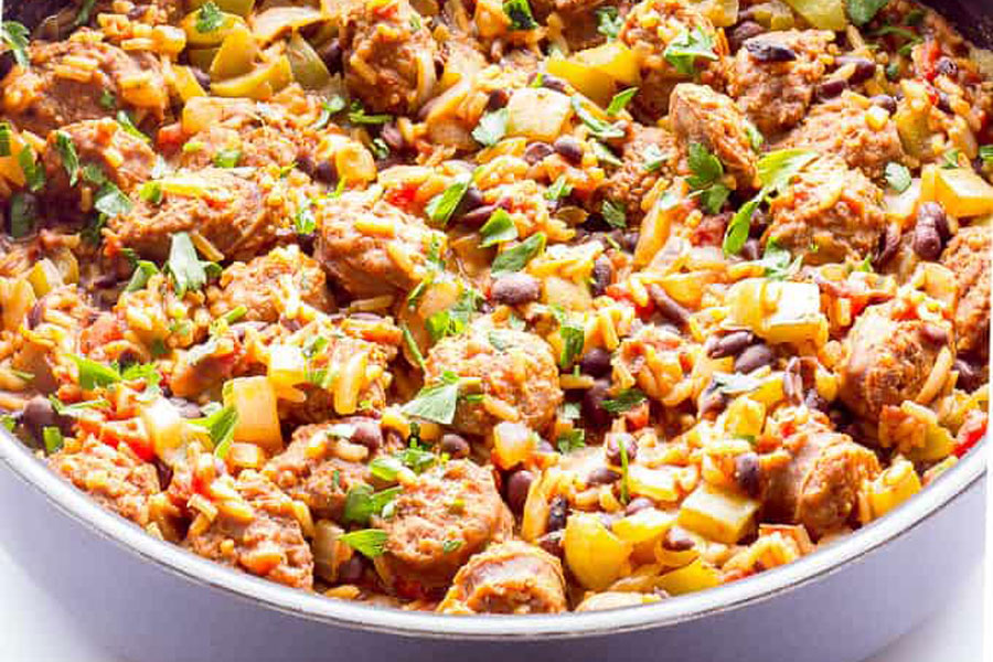Quick and Easy 1 Pot Chorizo and Spanish Rice Recipe! 1 Large white bowl close-up of rice and mexican chorizo brands from Chorizo San Luis!