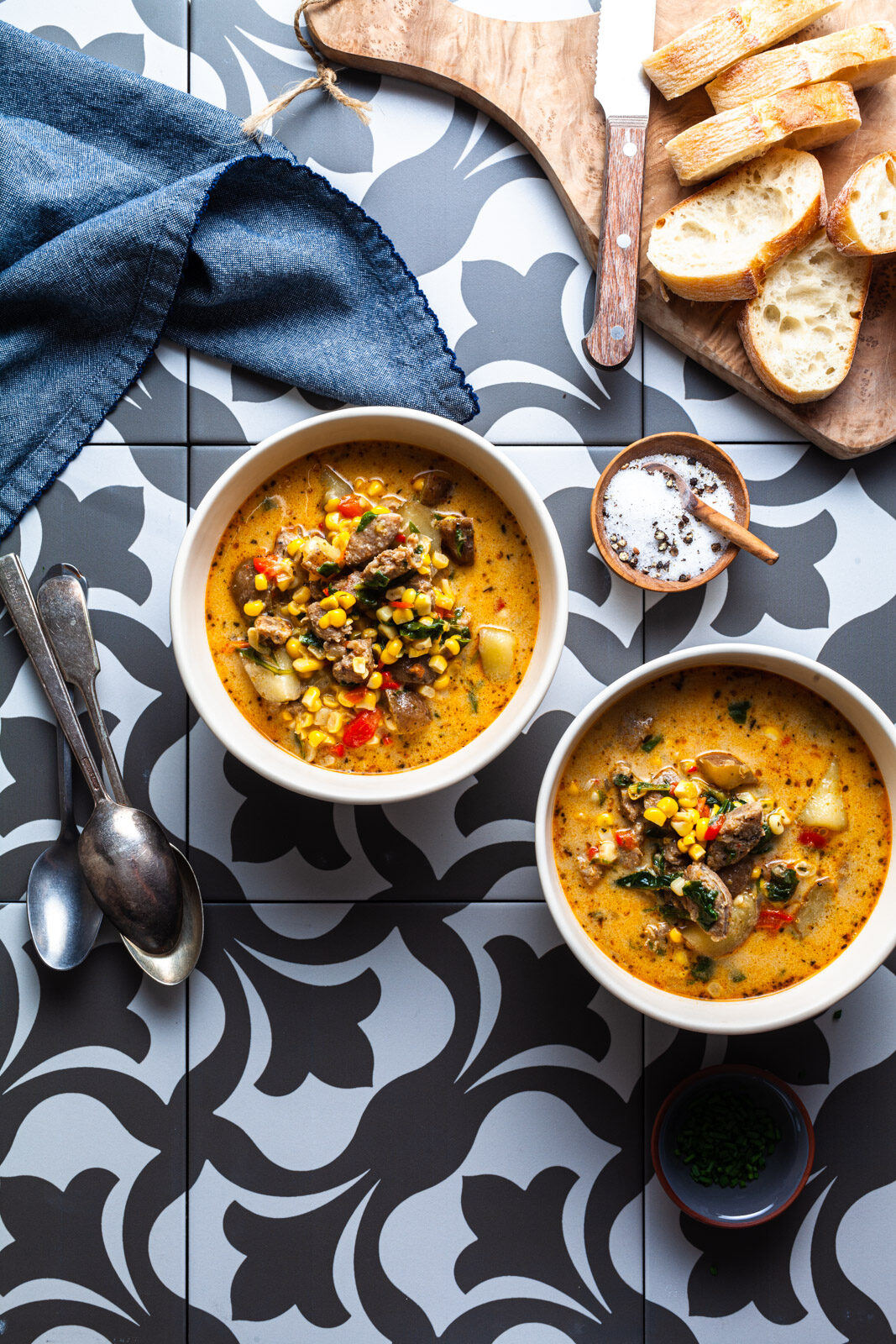 White bowl of Mexican of pork chorizo and corn with a chorizo recipes.