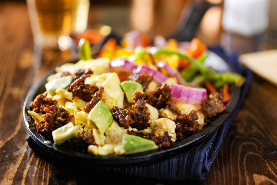 Texas brand chorizo in a skillet with scrambled eggs