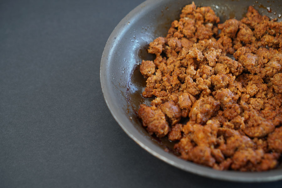 Large grey platter of chicken Mexican chorizo and San Luis Chorizo cooked.