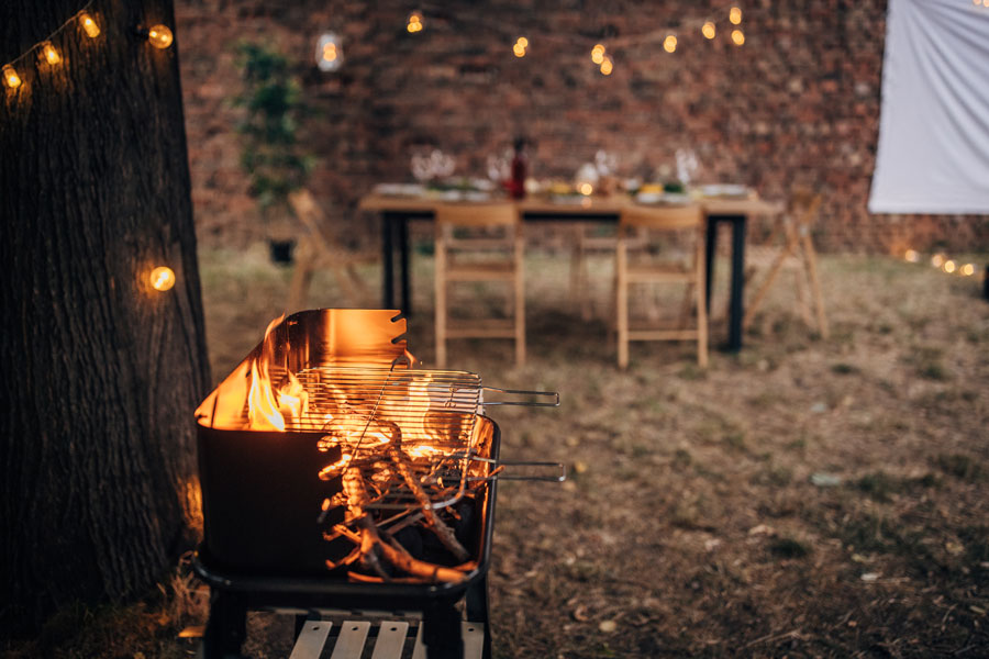 prime new york strip cooking outdoors.