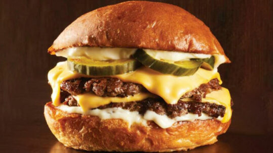 towering double patty burger made with mexican chorizo and prime beef products.