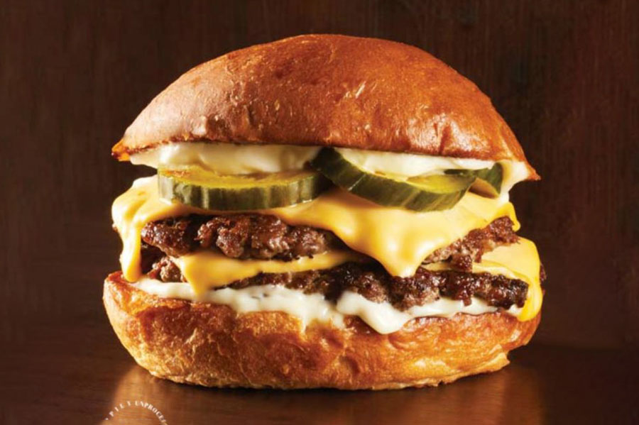 towering double patty burger made with mexican chorizo and prime beef products.