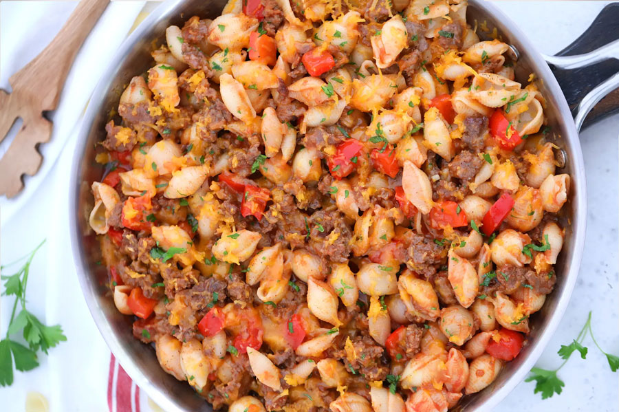 Make Dinnertime Special With Cheesy Texas Brand Chorizo Pasta! 1 Texas brand chorizo cooked in a pasta and chese post over veggies.