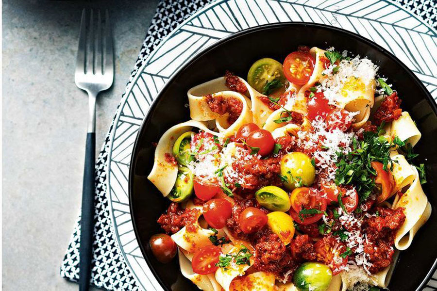White bowl of mexican chorizo and bolognese pasta