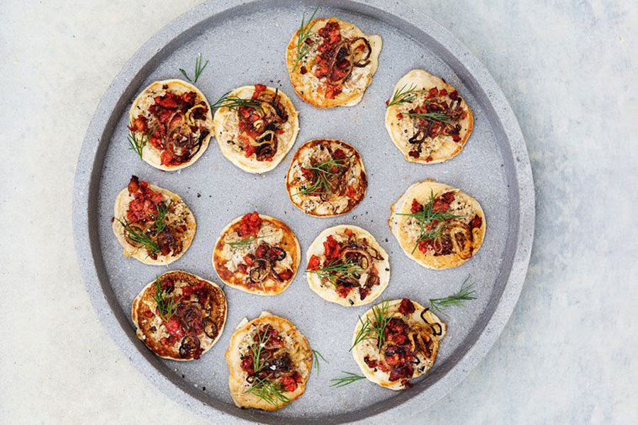 photo of Texas brand chorizo appetizer blinis on white table.