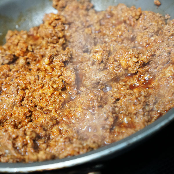 Our Texas brand chorizo frying on a pan.