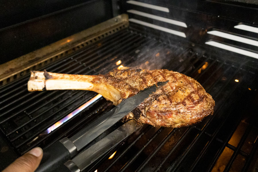 Prime steak on a grill