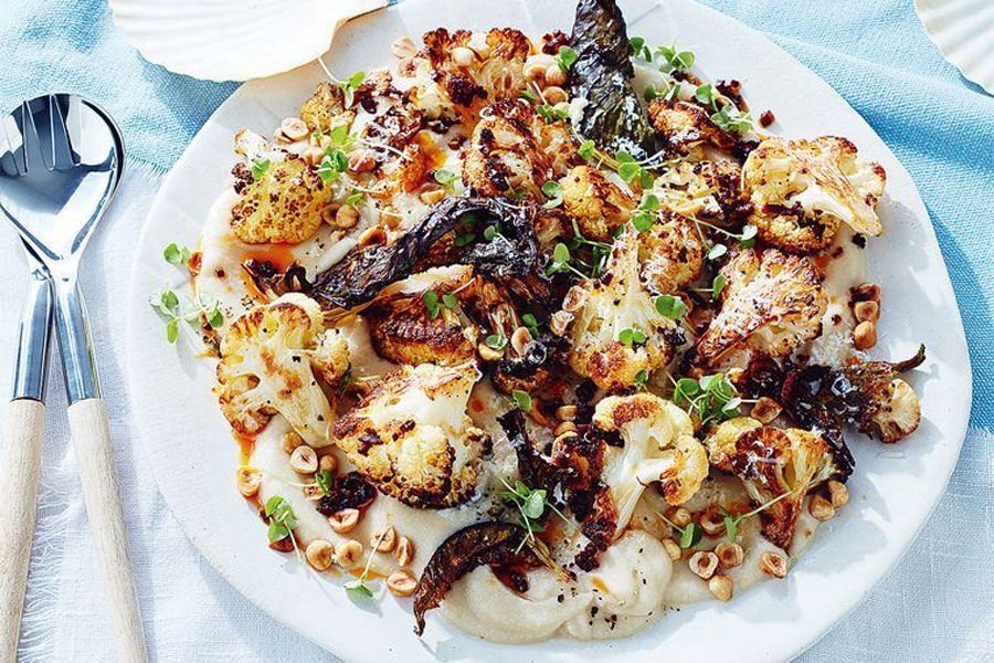 Garnish this 9 Ingredient Savory Salad with Mexican Chorizo 1 White bowl filled with cauliflower and Chorizo de san Manuel Mexican chorizo.